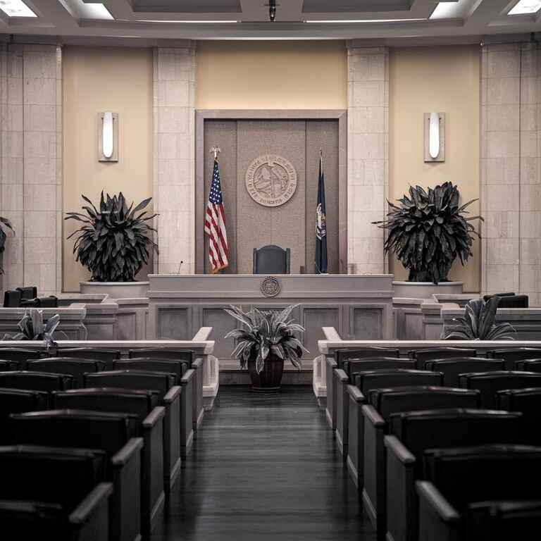 A courtroom in Las Vegas showing a judge’s bench and seating areas, representing legal consequences.