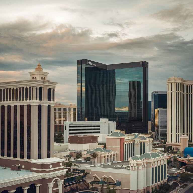 A bustling Las Vegas cityscape showing casinos and banks, representing the environment for joint money laundering schemes.