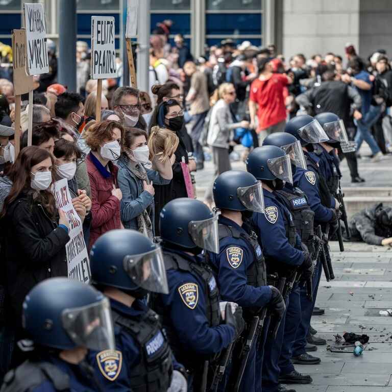 Police officers dispersing a crowd at an unlawful protest in Nevada