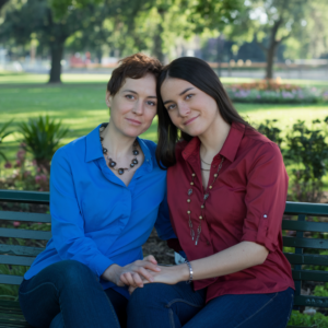 Same-sex couple consulting with legal professional about divorce proceedings.